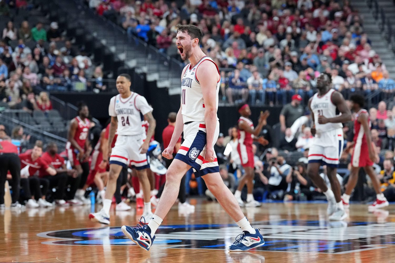 UConn Huskies forward Alex Karaban reacts after a play.